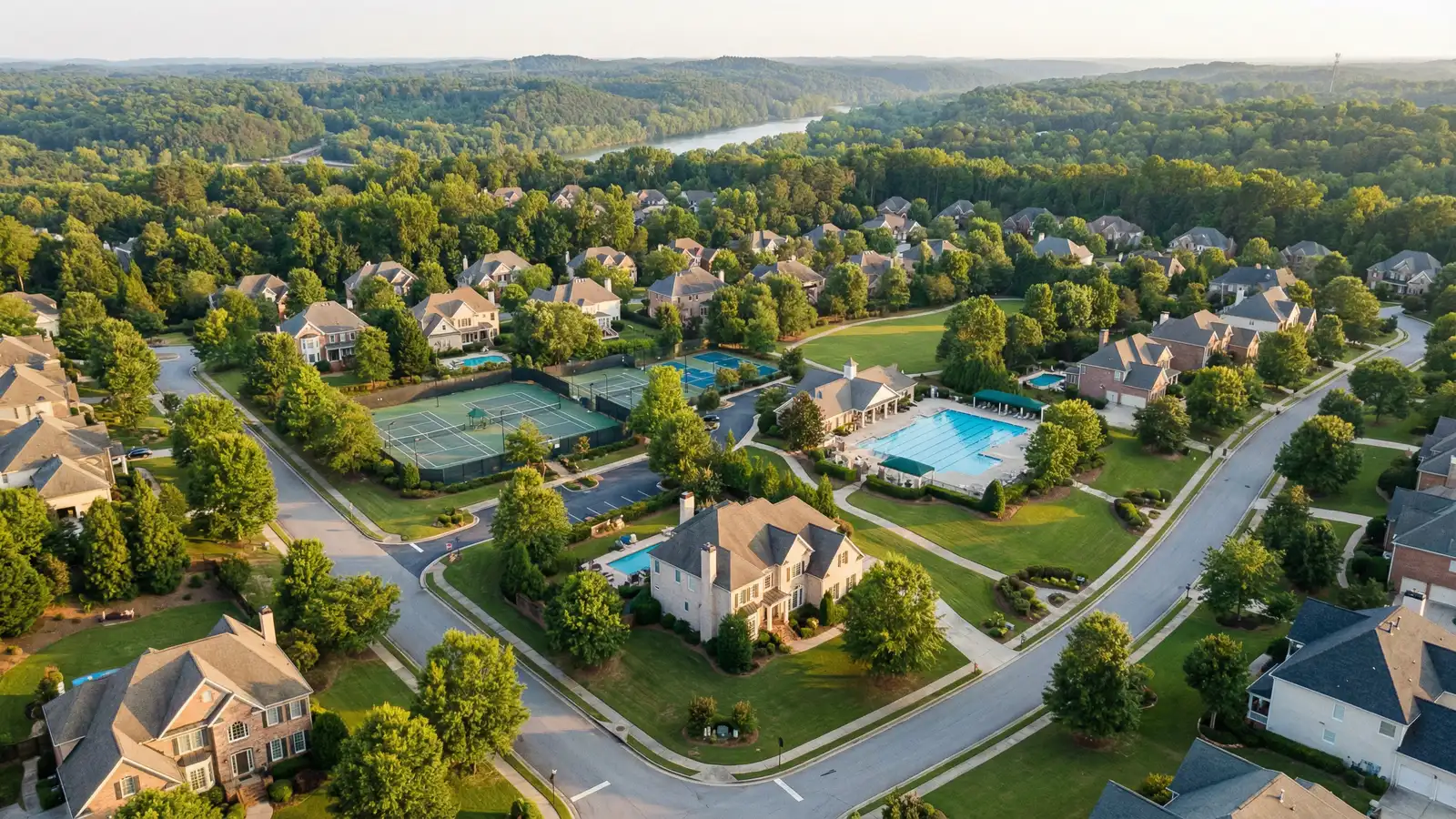 Upscale suburban neighborhood with manicured homes and community tennis courts in Johns Creek Georgia