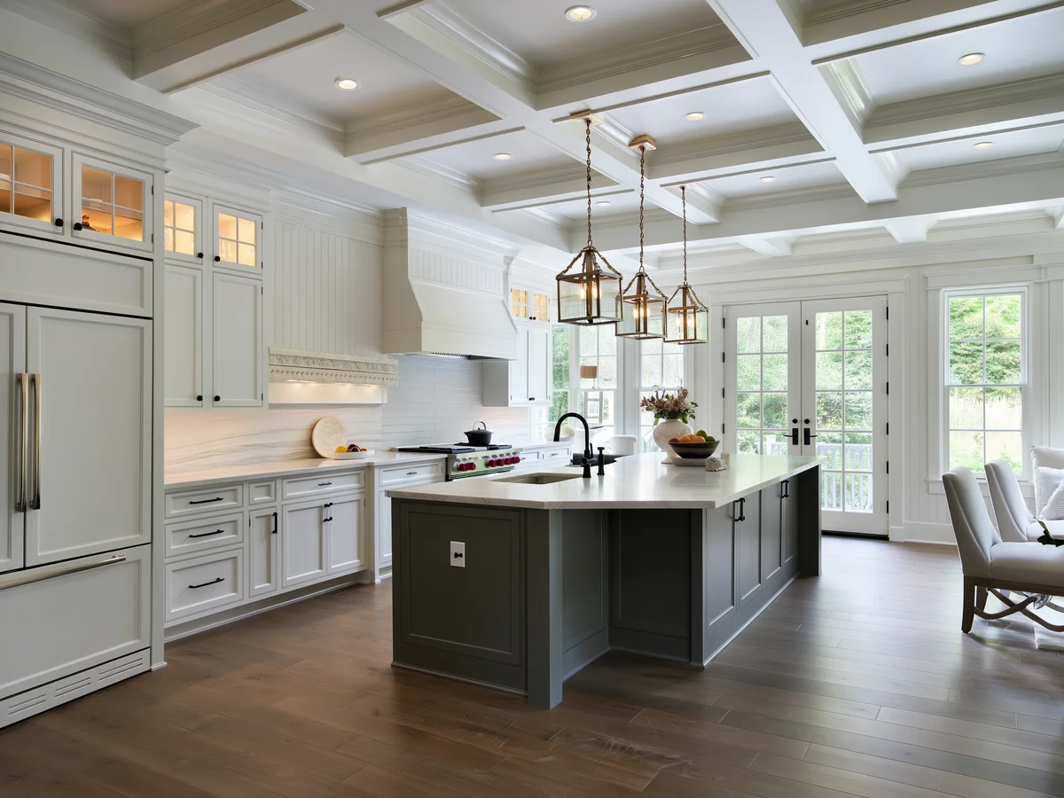 Luxury home interior with custom millwork coffered ceiling and designer kitchen in a north Atlanta estate